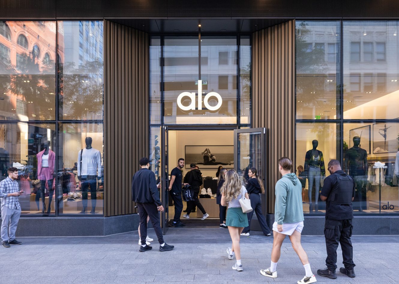 An exterior photograph of the Alo grand opening at Hudson's Detroit, featuring activation.