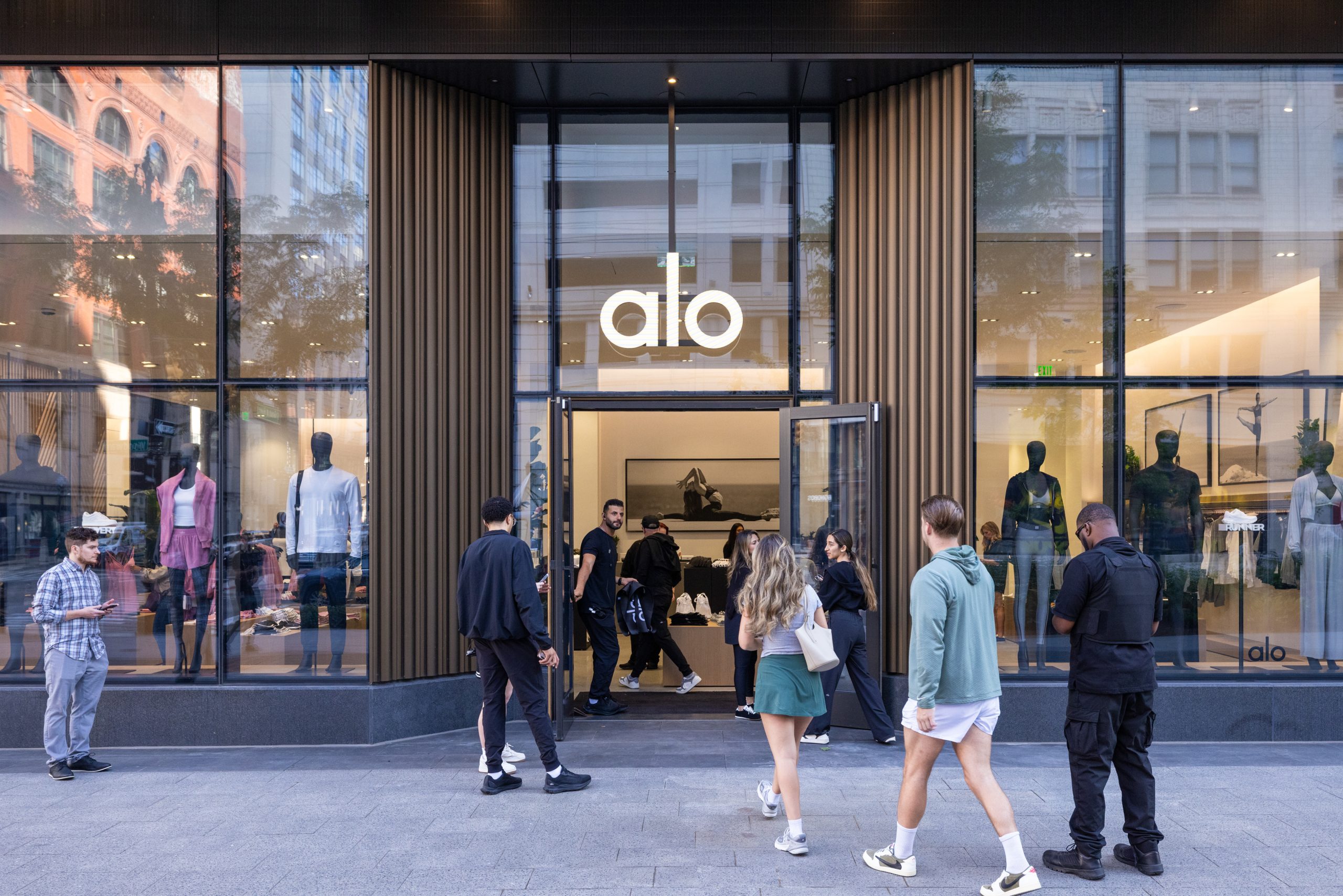 An exterior photograph of the Alo grand opening at Hudson's Detroit, featuring activation.