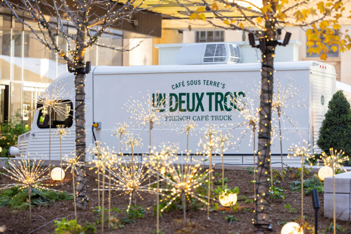 A photo of Un Deux Trois with holiday decorations.